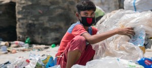 Twelve-year-old boy in Dhaka, capital of Bangladesh, sorts through hazardous plastic waste without any protection, working to support his family amidst the coronavirus lockdown. Credit: UNICEF/Parvez Ahmad